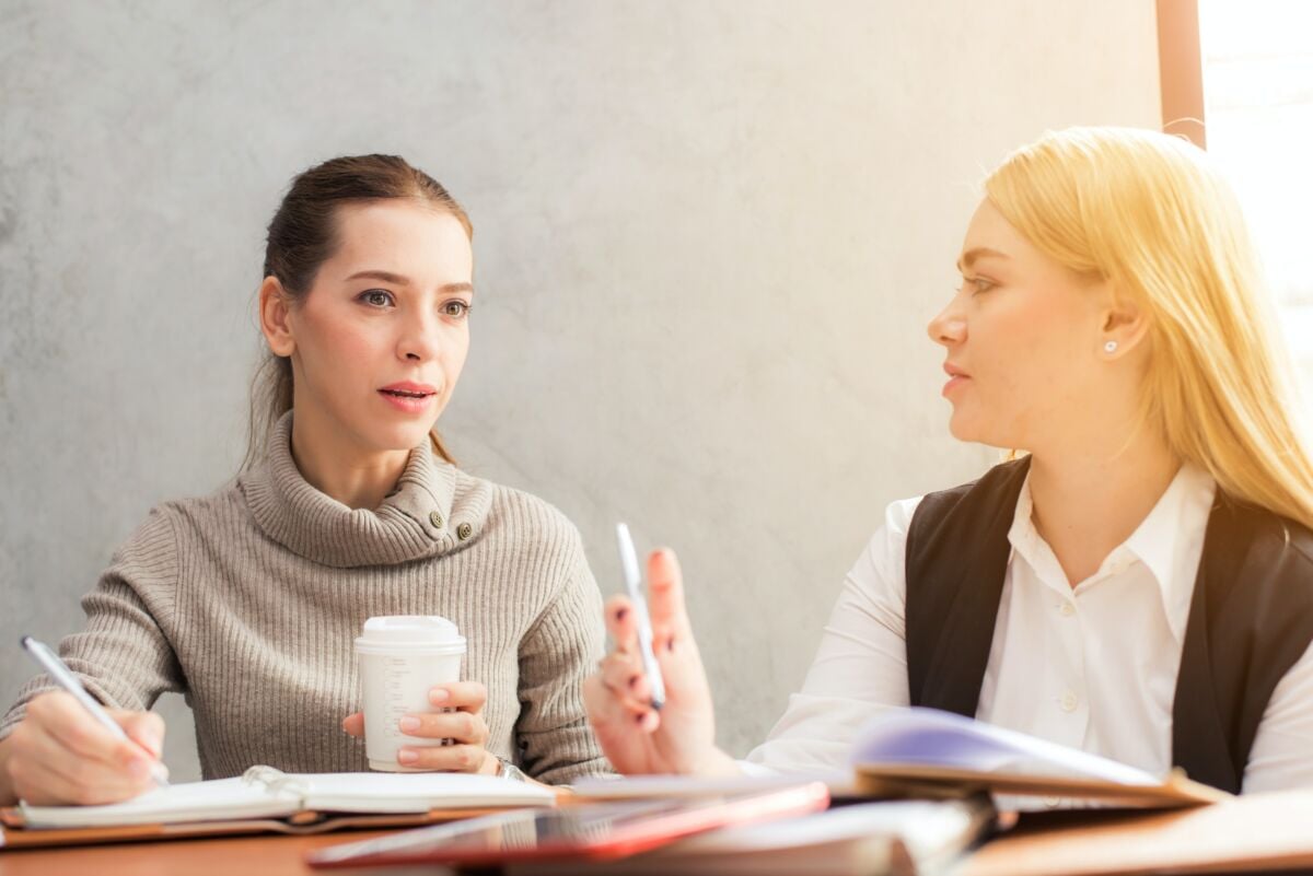 Two women discussing