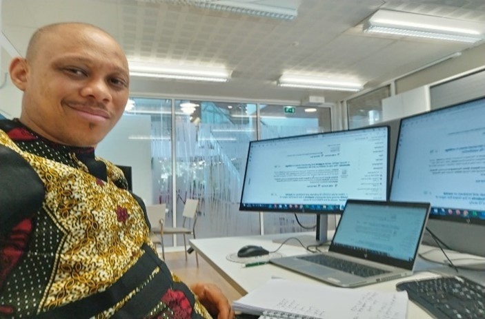 A Man at his work desk